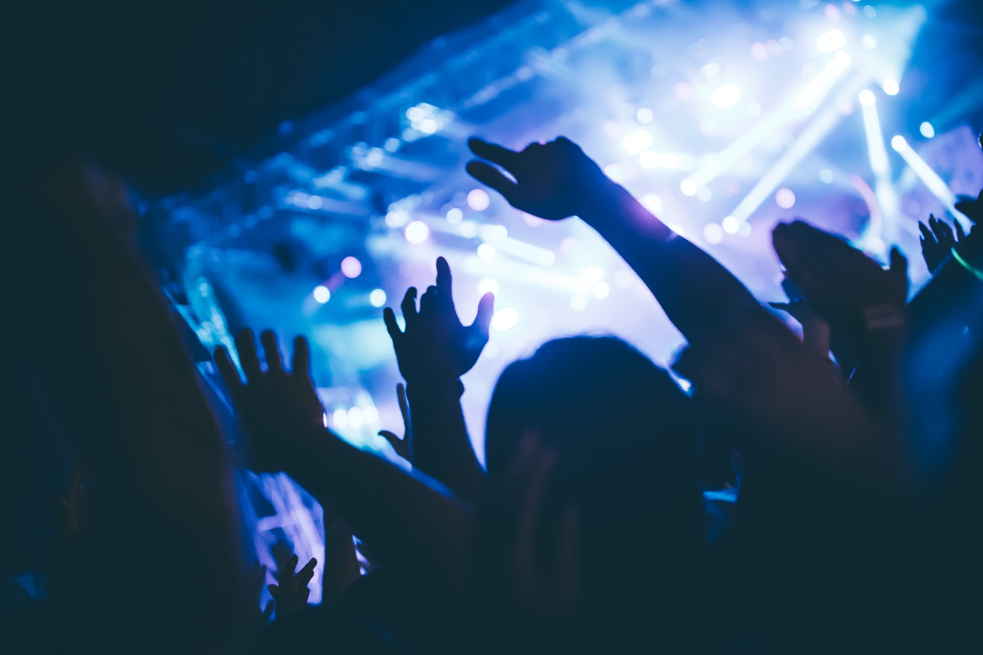 cheering-crowd-at-concert-enjoying-music-performance.jpg